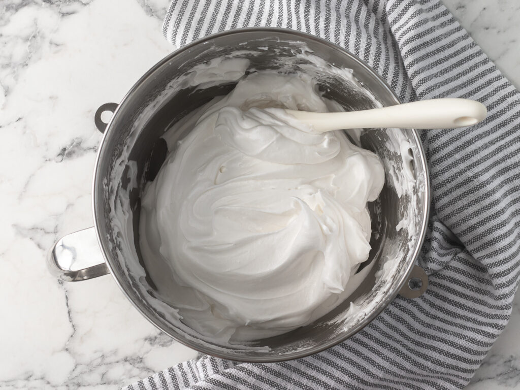 Meringue after it has been whipped to stiff peaks