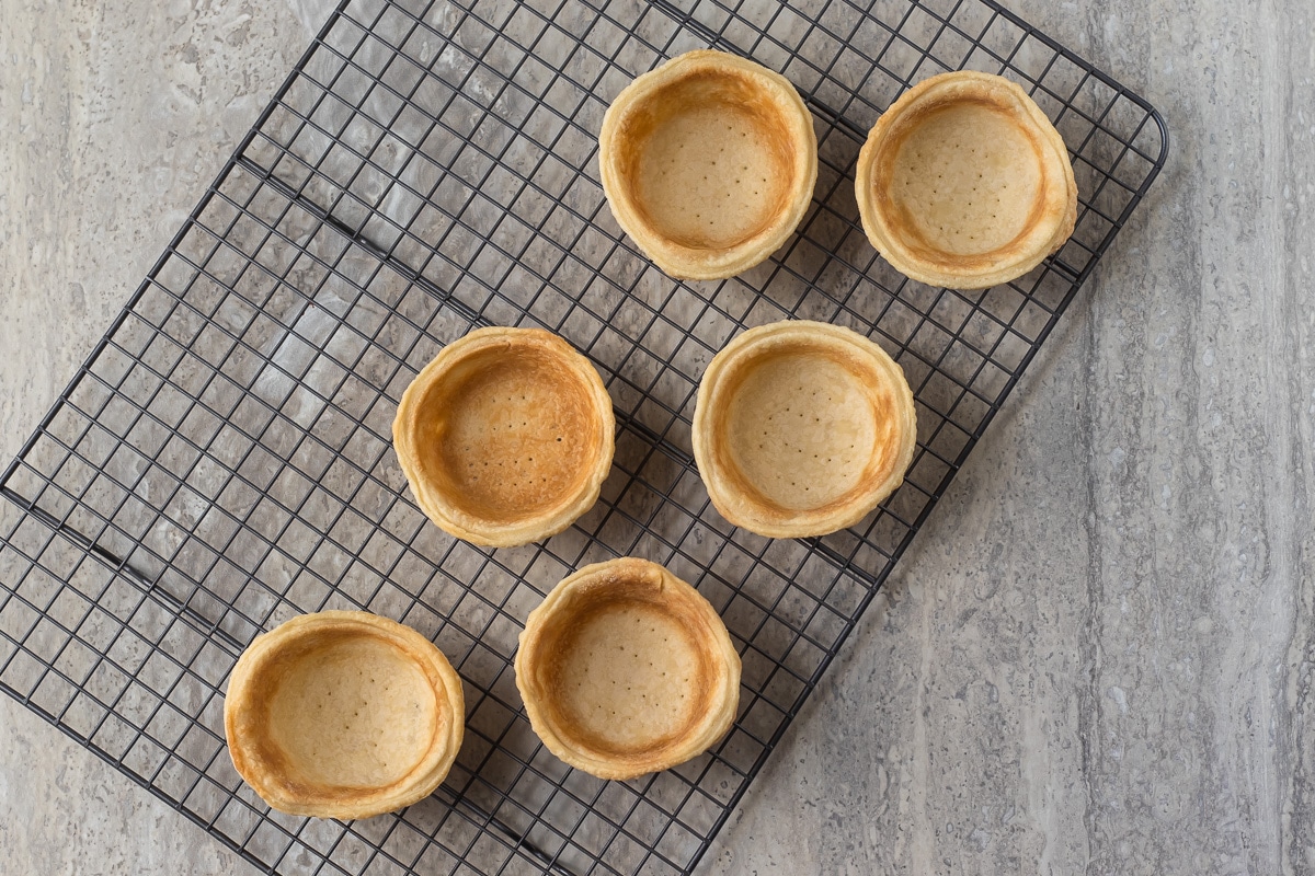 crusts cooling to room temperature on a cooling rack.