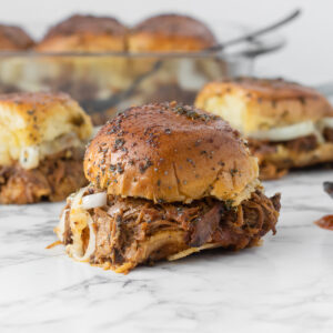 Pork sliders with toasty buns, tender apple butter bbq pulled pork made in the slow cooker.