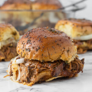 Pork sliders with toasty buns, tender apple butter bbq pulled pork made in the slow cooker.