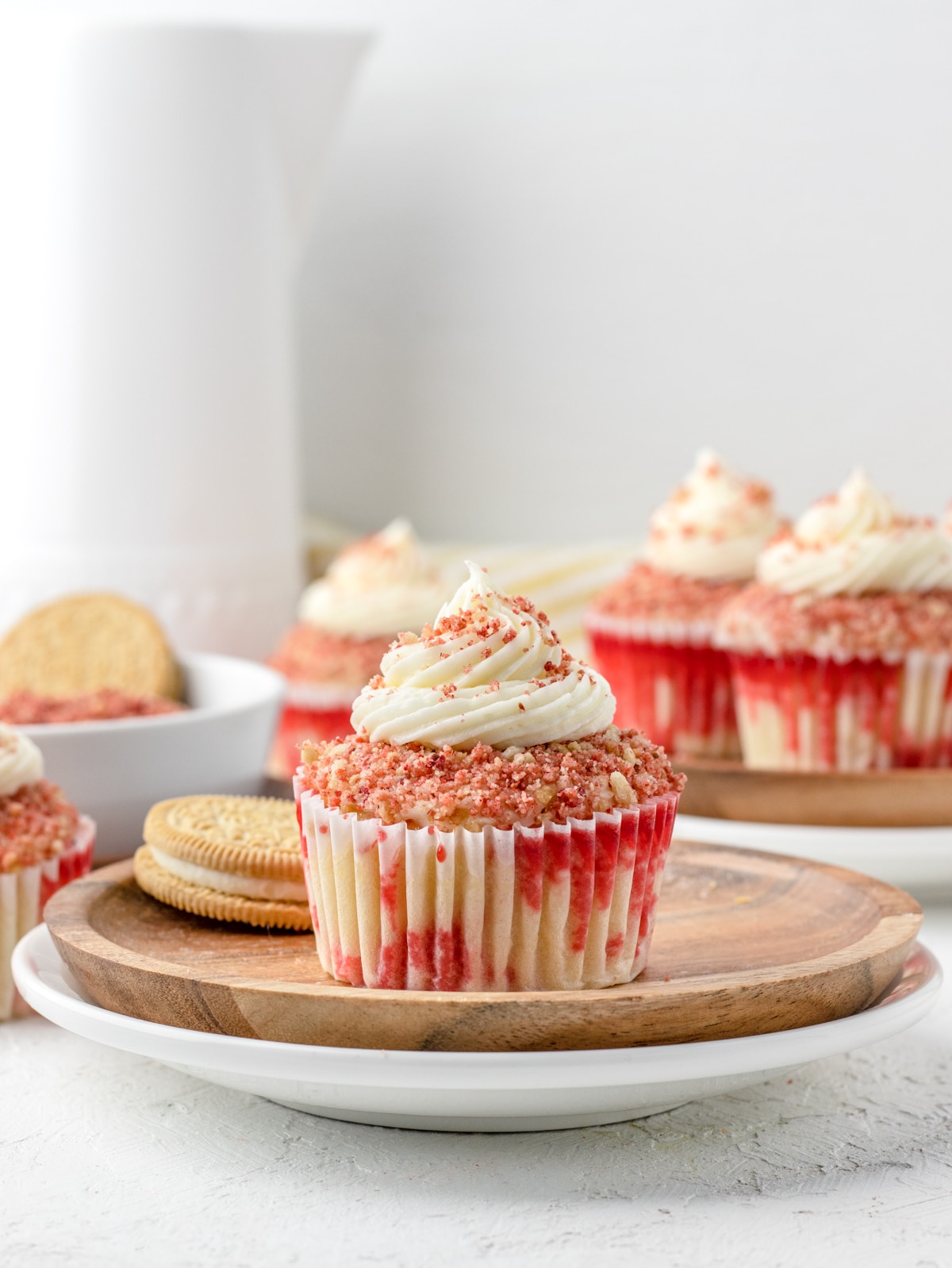 Strawberry jello cupcakes topped with not so sweet vanilla buttercream, and strawberry crunch.
