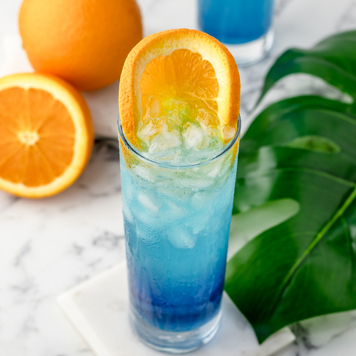 This Blue Lagoon Mocktail is citrusy, refreshing, and beautifully blue. It takes 5 minutes, requires only 3 ingredient, and has no alcohol.