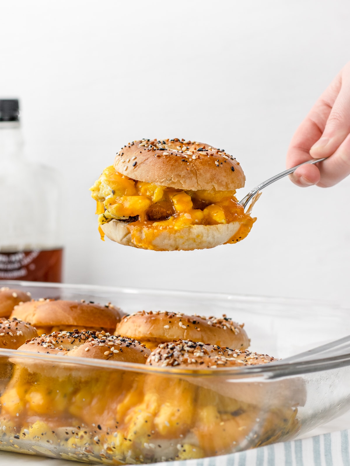 Breakfast Bagel Slider being lifted from the pan and served at brunch.