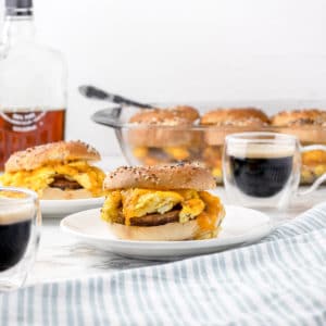 Easy Breakfast Bagel Sliders served with espresso and maple syrup.