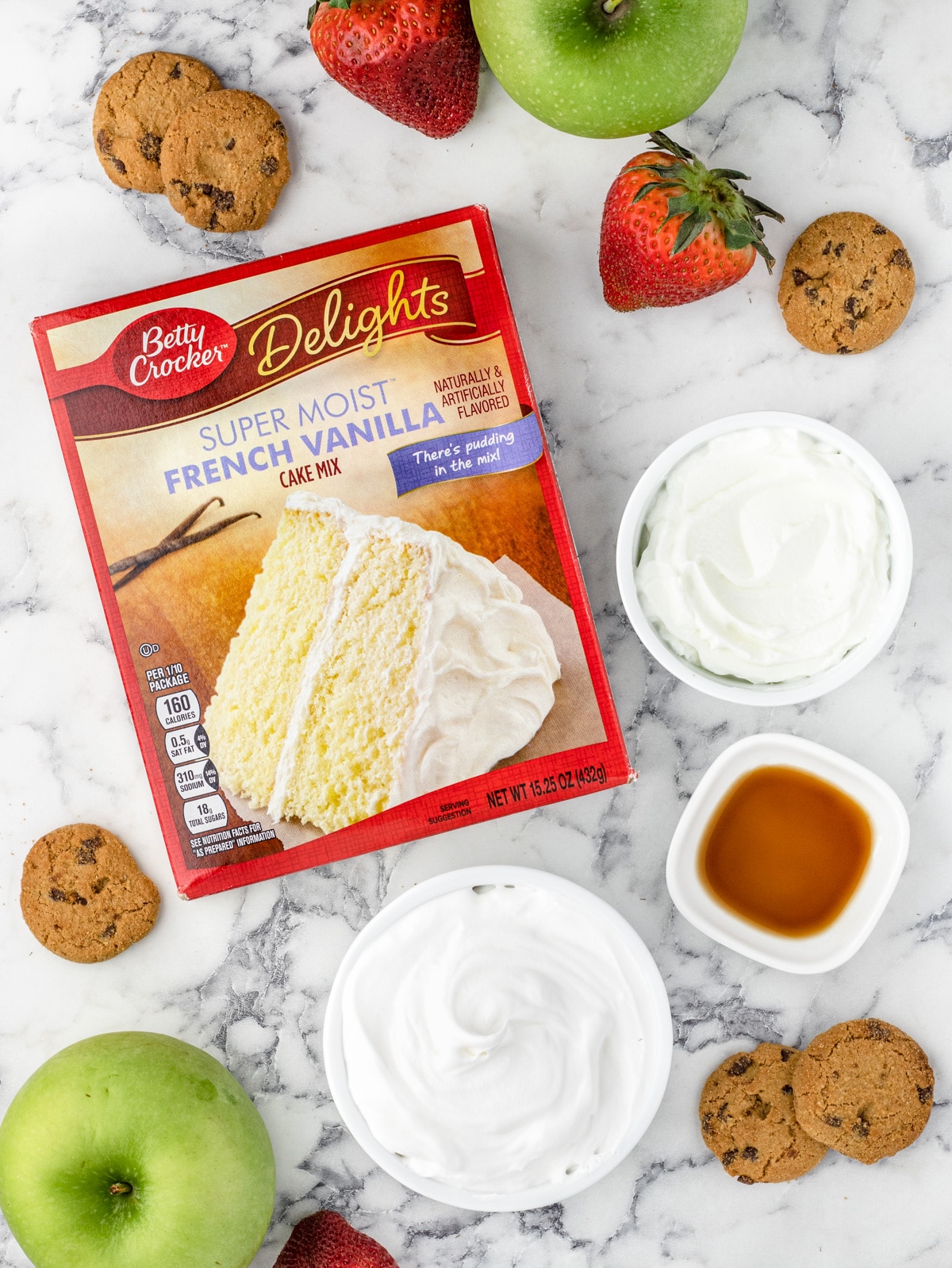 Ingredients: box of vanilla cake mix, Greek yogurt, whipped cream, and vanilla extract. With chocolate chip cookies, whole apples, and whole strawberries on the side.