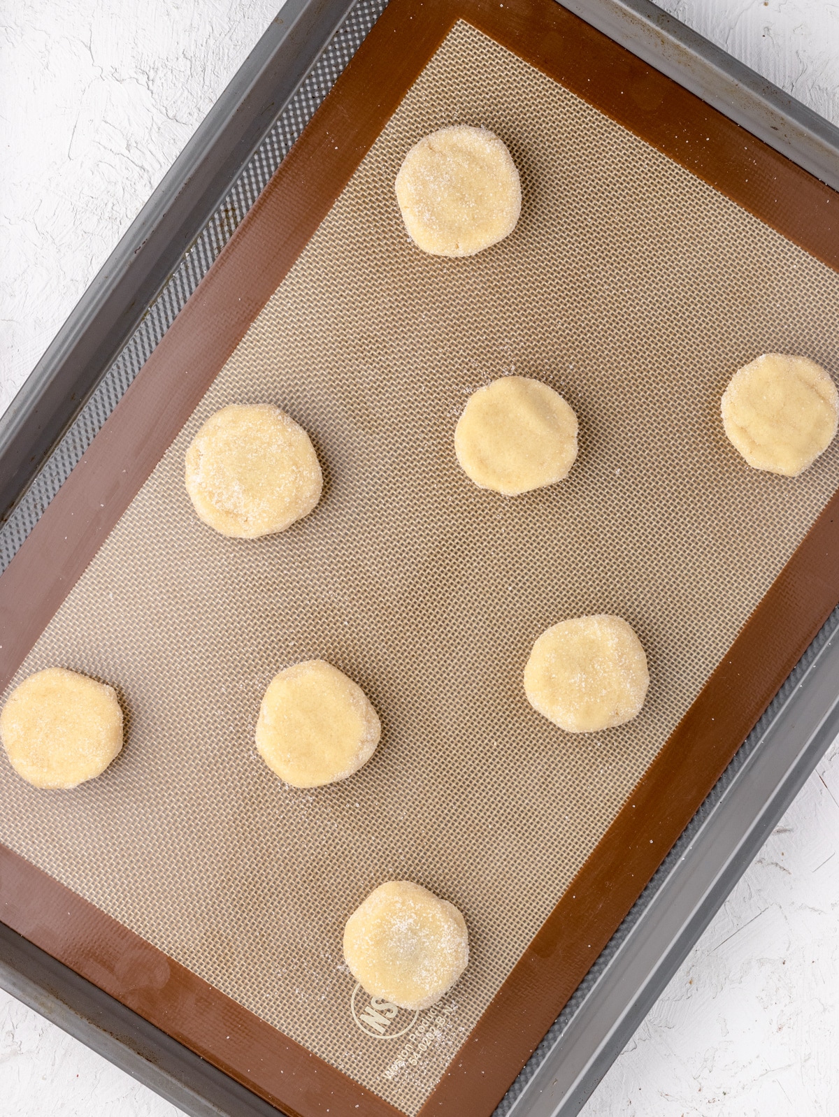 Cookies on cookie sheet ready to be baked.