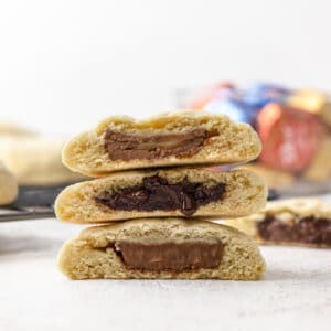 3 Chocolate Filled Cookies stacked. Milk chocolate, dark chocolate, and caramel filled chocolates in the cookies.