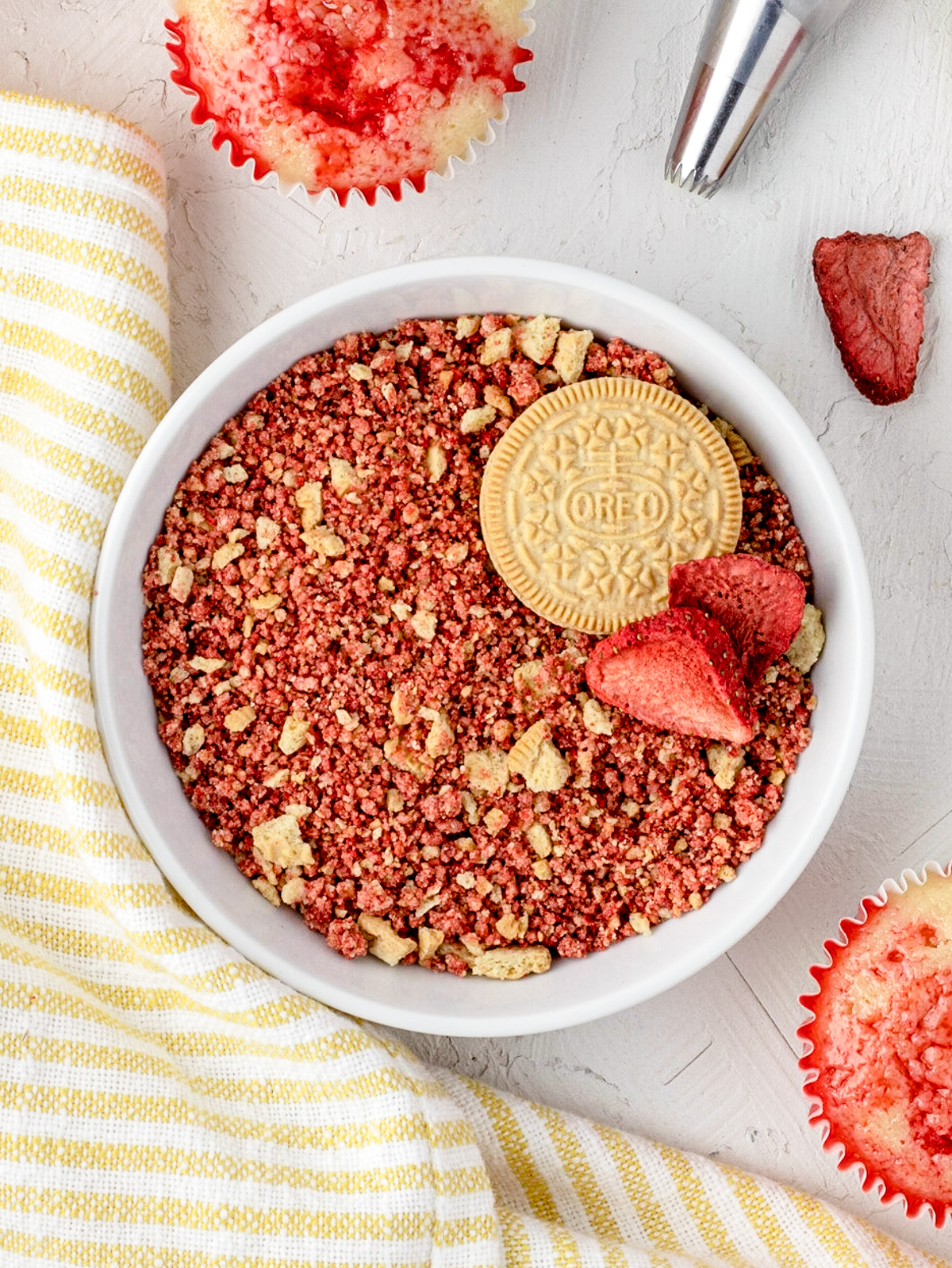 Bowl of strawberry crunch crumbles ready to sprinkle on desserts.