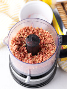 Fully pulsed Strawberry Crunch Topping in food processor ready to eat.