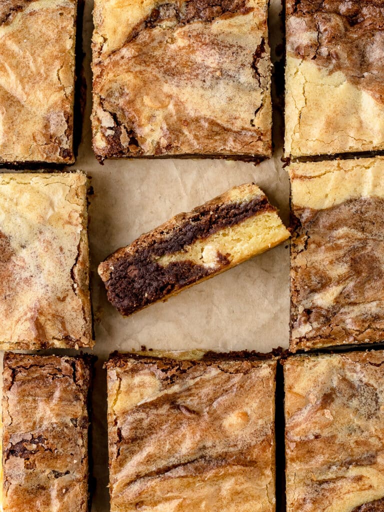 Overhead shot of Brownie Blondies with one flipped up to see the swirls of brownie and blondie.