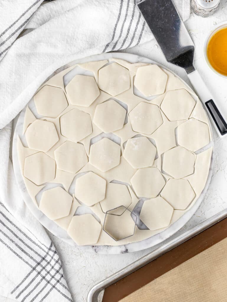 Pie Dough cut out with an hexagon cookie cutter.