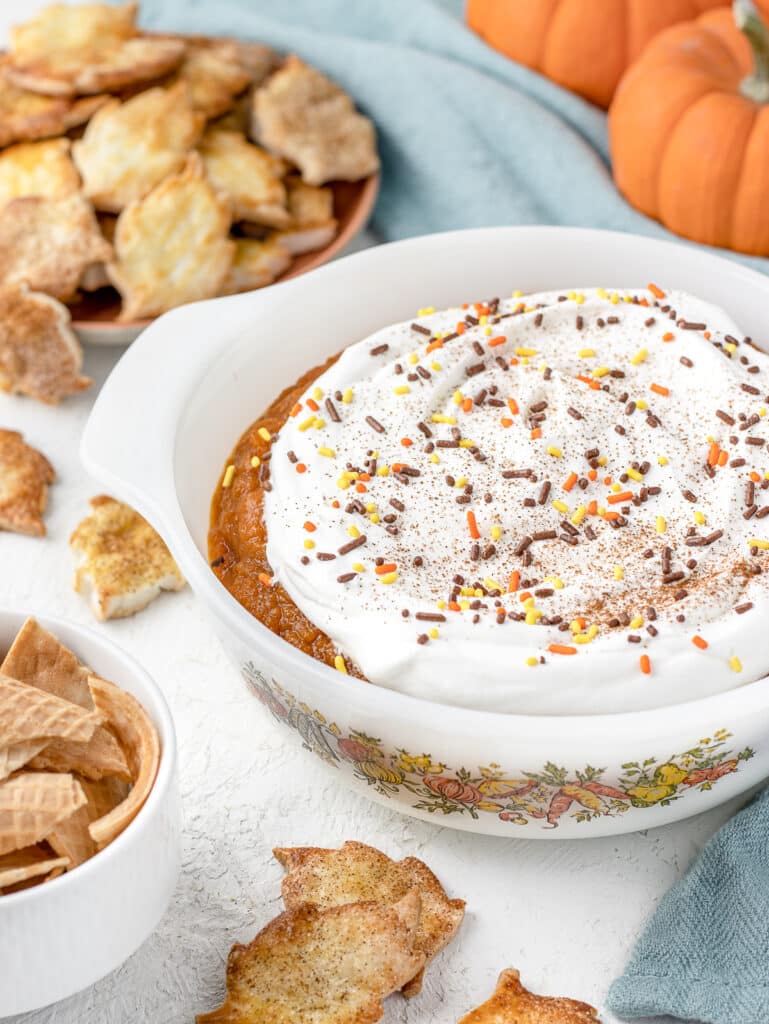 Pumpkin Pie Dip in an antique serving dish with pie crust chips and broked sugar cones for dippers.