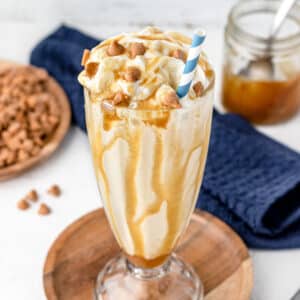 Butterscotch Milkshake with extra butterscotch sauce and chips on the side