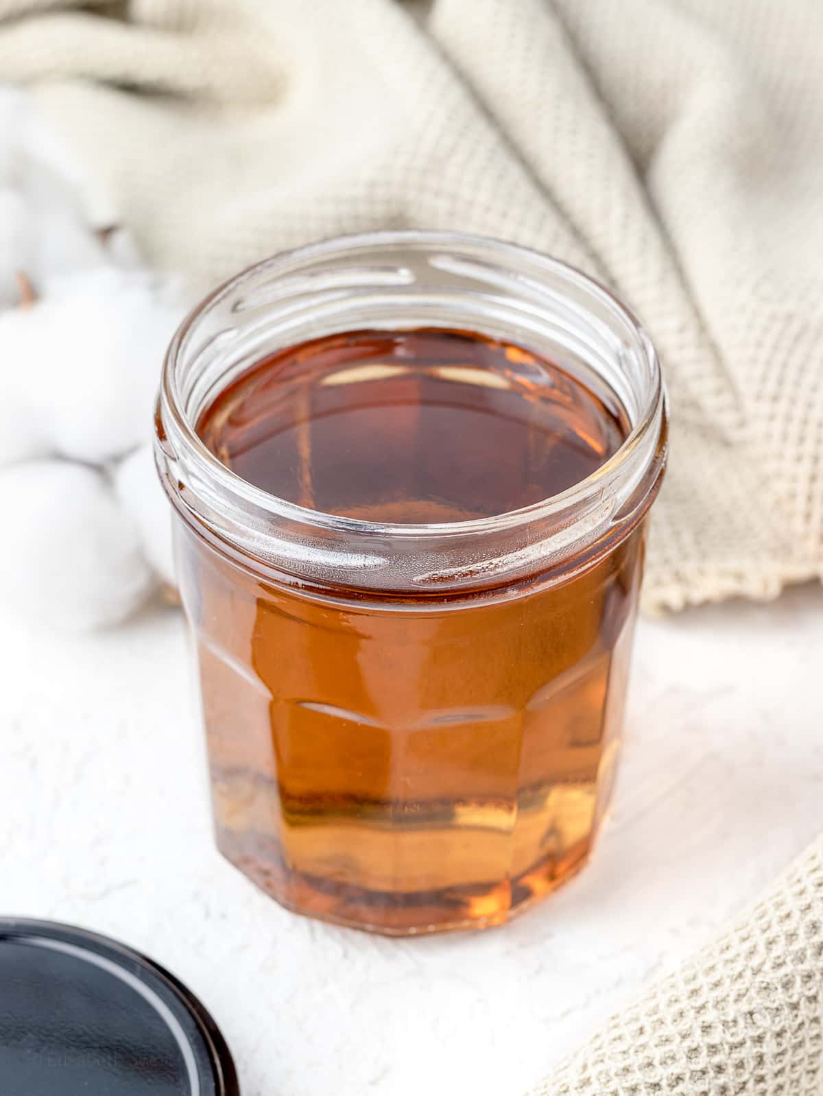 Caramel Simple Syrup in a glass jar.