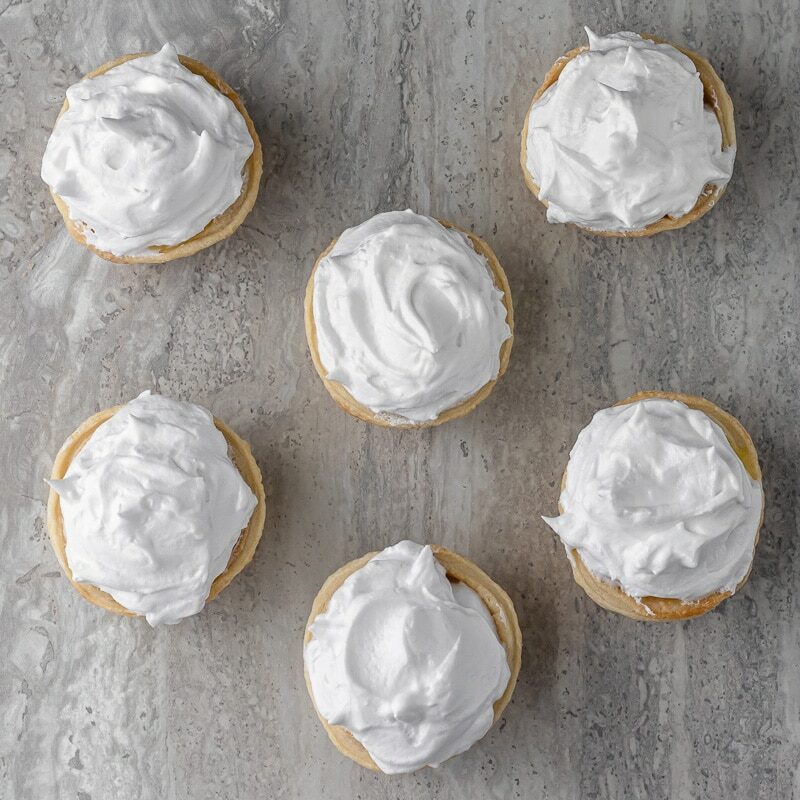 Overhead shot of pies with white fluffy meringue.
