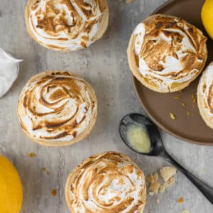 Quick and easy Mini Lemon Meringue Pies with perfectly toasted meringue, smooth curd, and flaky crust.