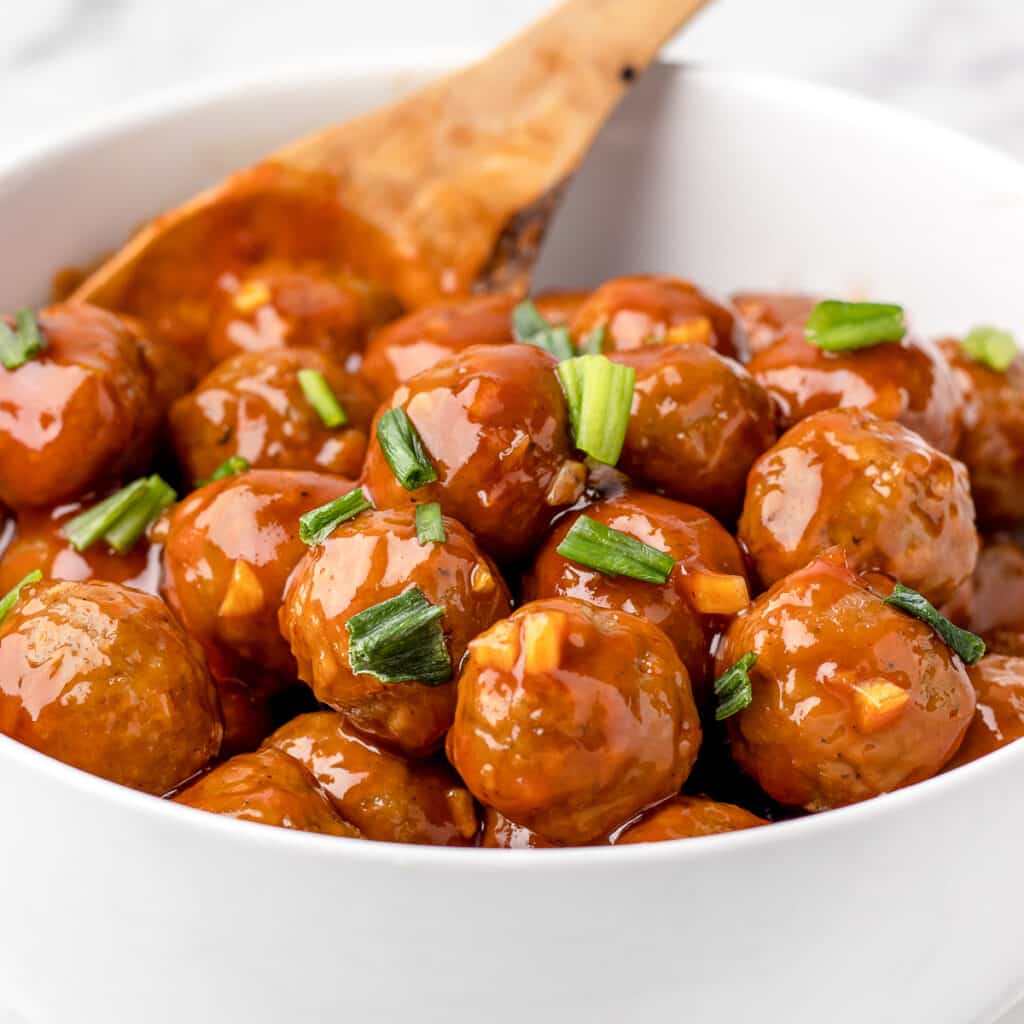 Honey Sriracha Meatballs ready to scoop out of the bowl and eat!