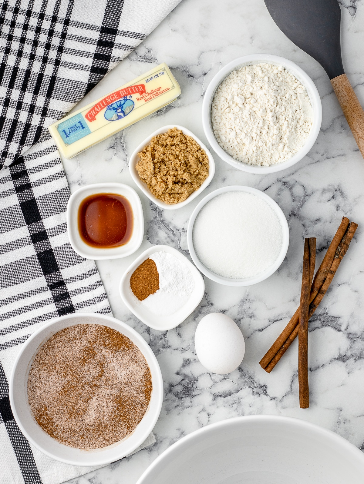 Ingredients for Snickerdoodles without cream of tartar. Unsalted butter, granulated sugar, brown sugar, vanilla extract, egg, all purpose flour, baking powder, cinnamon, salt, cinnamon sugar coating.