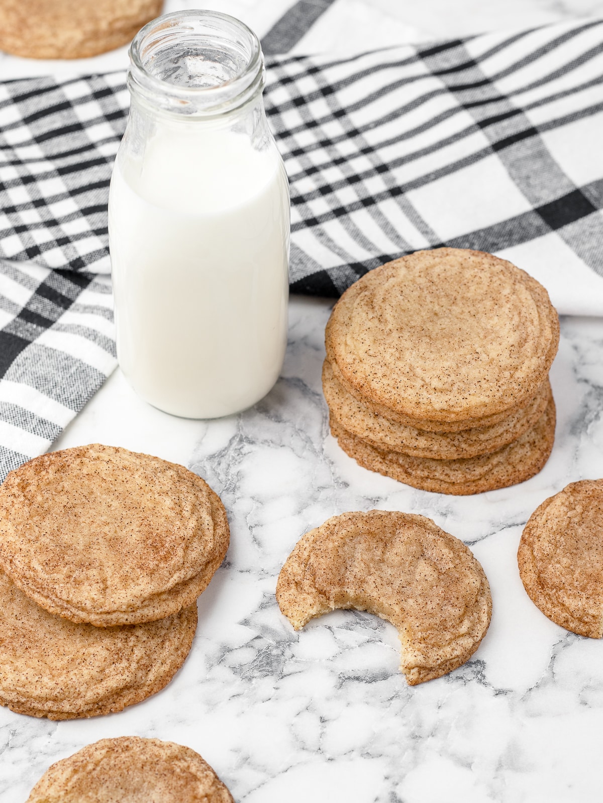 Snickerdoodle without cream of tartar cookies ready to eat with a cold jar of milk.