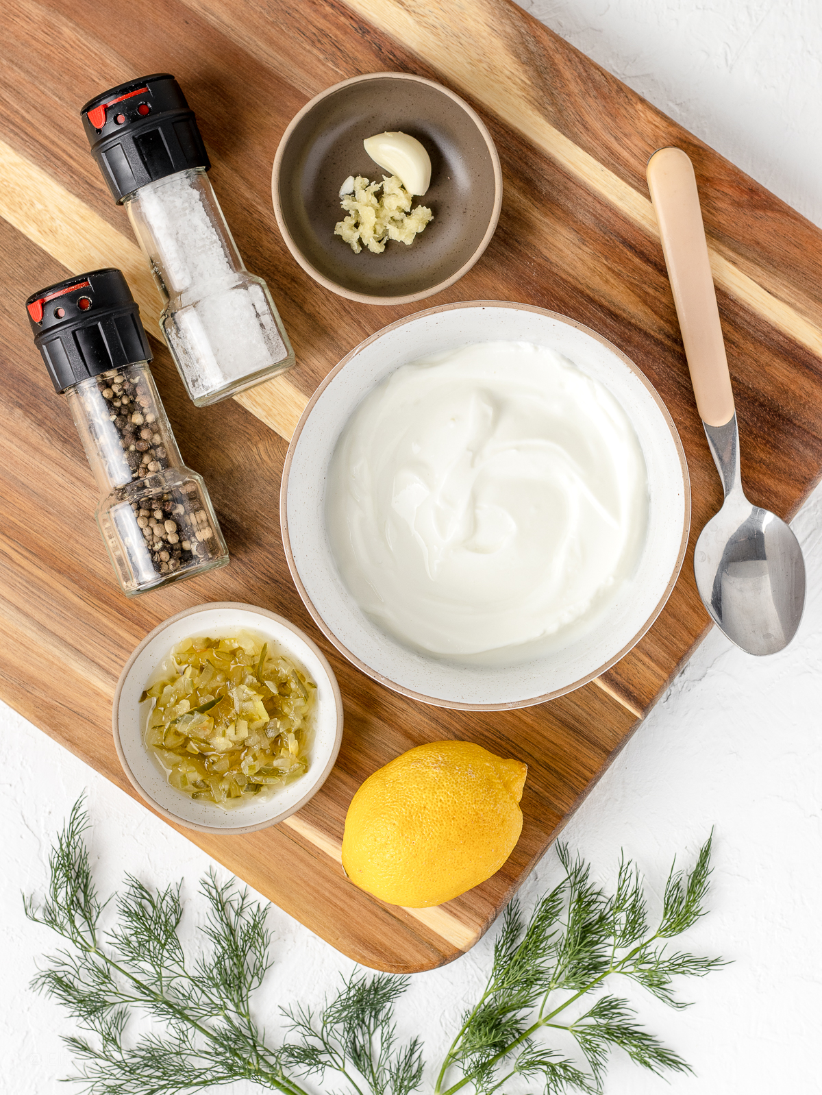 Ingredients. Greek yogurt, minced fresh garlic clove, dill pickle relish, lemon juice, salt, pepper, and fresh chopped dill.