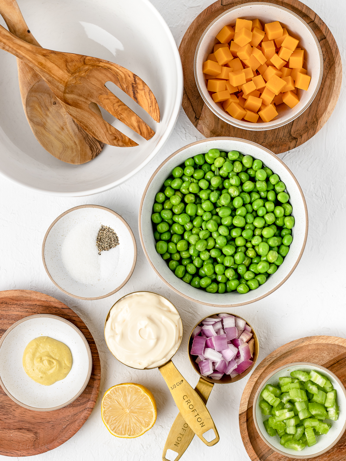 Ingredients. English peas, cheddar cheese, celery, red onion, mayonnaise, dijon mustard, lemon juice, granulated sugar, salt and pepper.