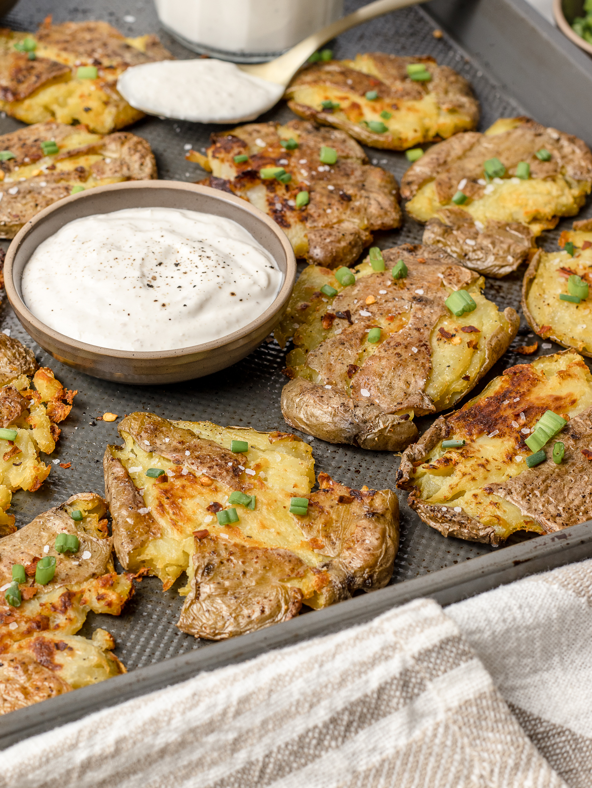 Smashed potatoes and a sheet pan ready to serve with dinner and eat.