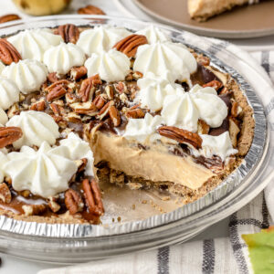 No bake turtle pie with one slice removed.
