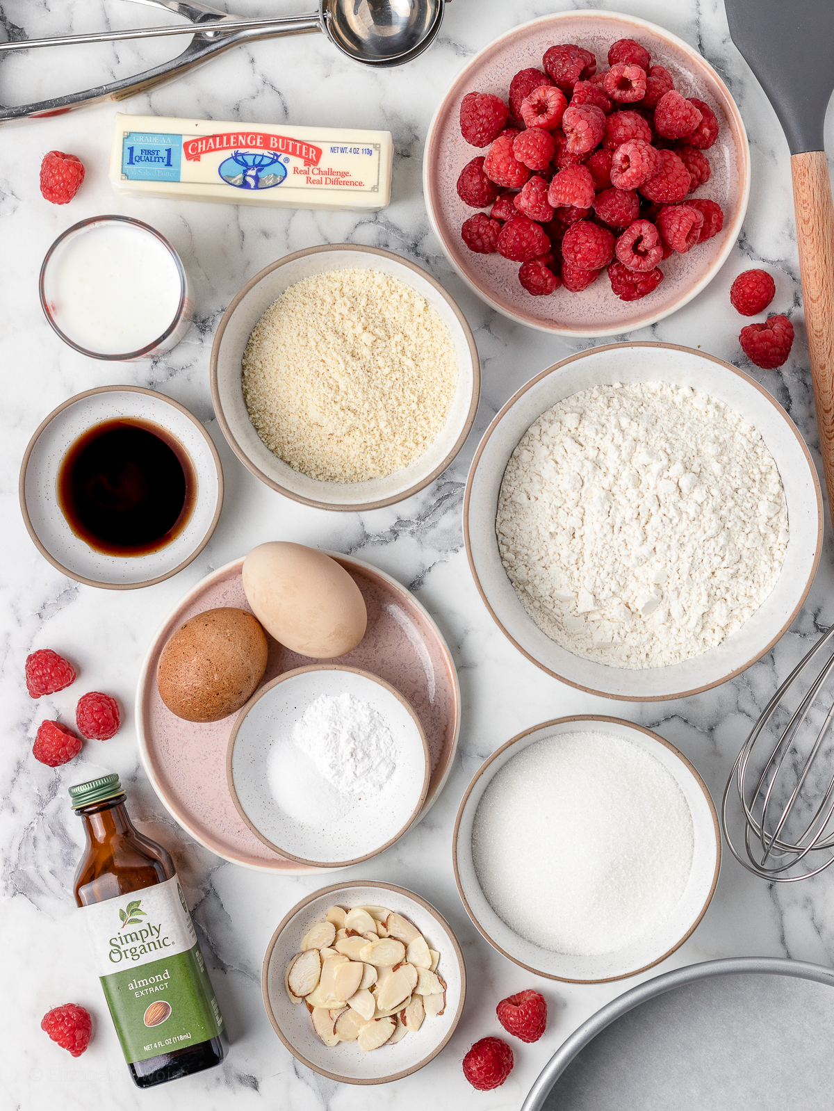 Ingredients for the cake. Fresh raspberries, unsalted butter, granulated sugar, almond extract, vanilla extract, eggs, all purpose flour, almond flour, baking powder, salt, buttermilk, and sliced almonds.