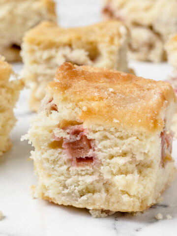 Close up of tender rhubarb snack cake with chunks of rhubarb.