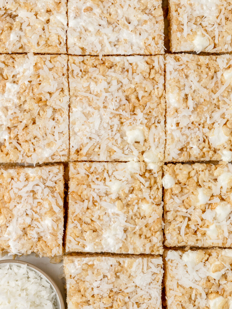 Overheat shot of Coconut Rice Krispie treats cut in 12 even squares.