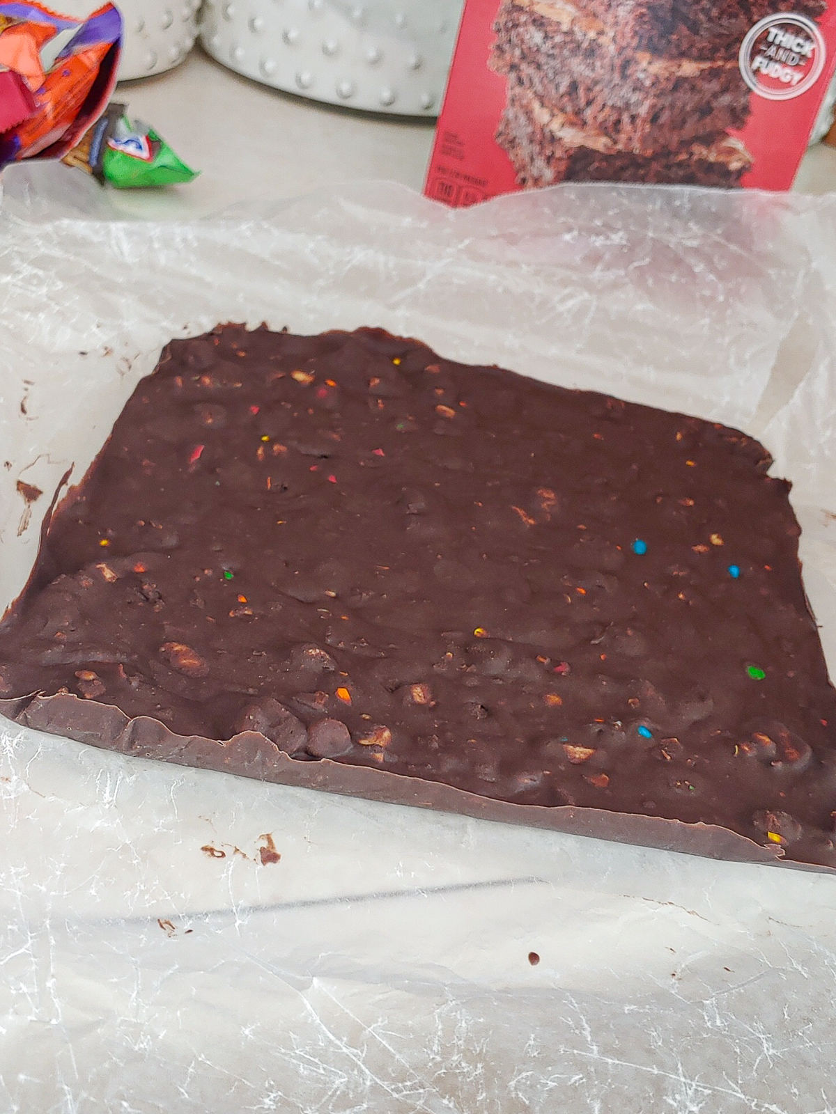 Frozen melted leftover Halloween candy ready to be sandwiched between 2 layers of brownie batter.