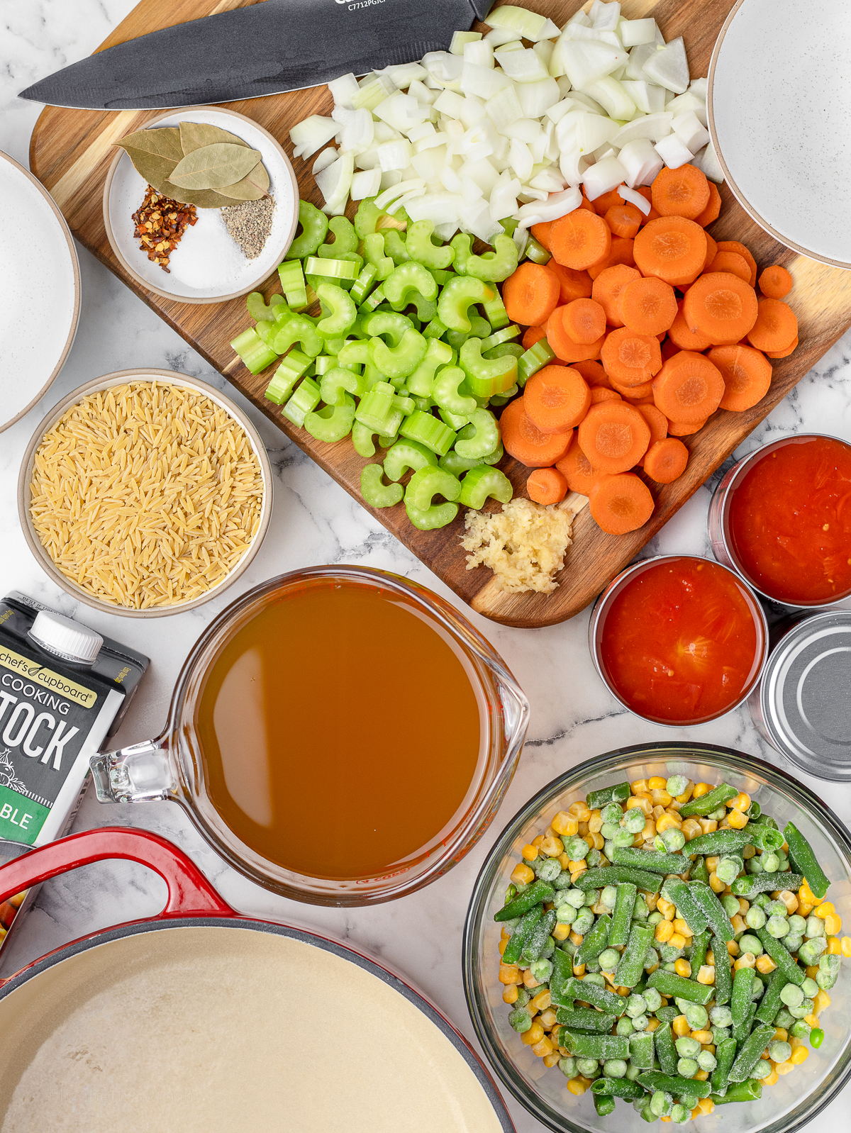 Ingredients. Yellow onion, carrots, celery, garlic, canned diced tomatoes, vegetable stock, bay leaves, salt, black pepper, red pepper flakes, frozen green beans, frozen sweet corn, frozen peas, uncooked orzo pasta.