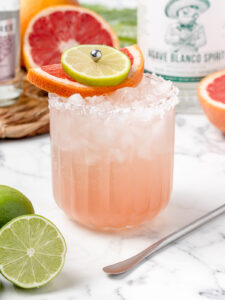 Step 4. Garnish the paloma with a grapefruit slice and a lime slice.