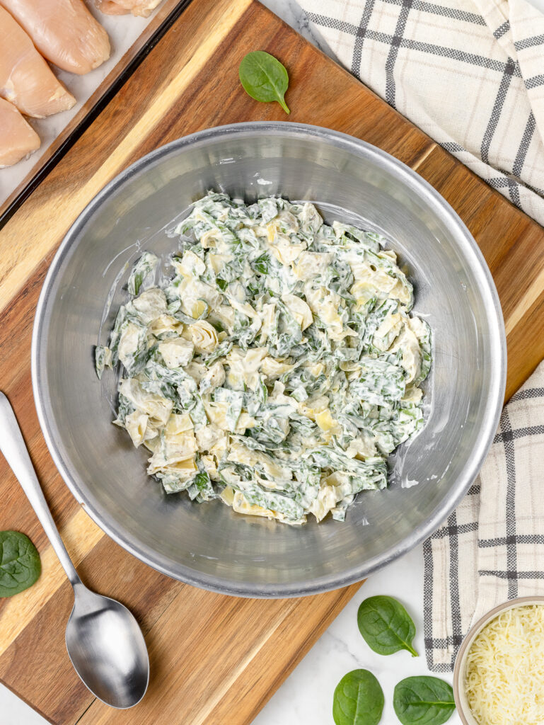 Step 2. Combine the creamy spinach artichoke topping.