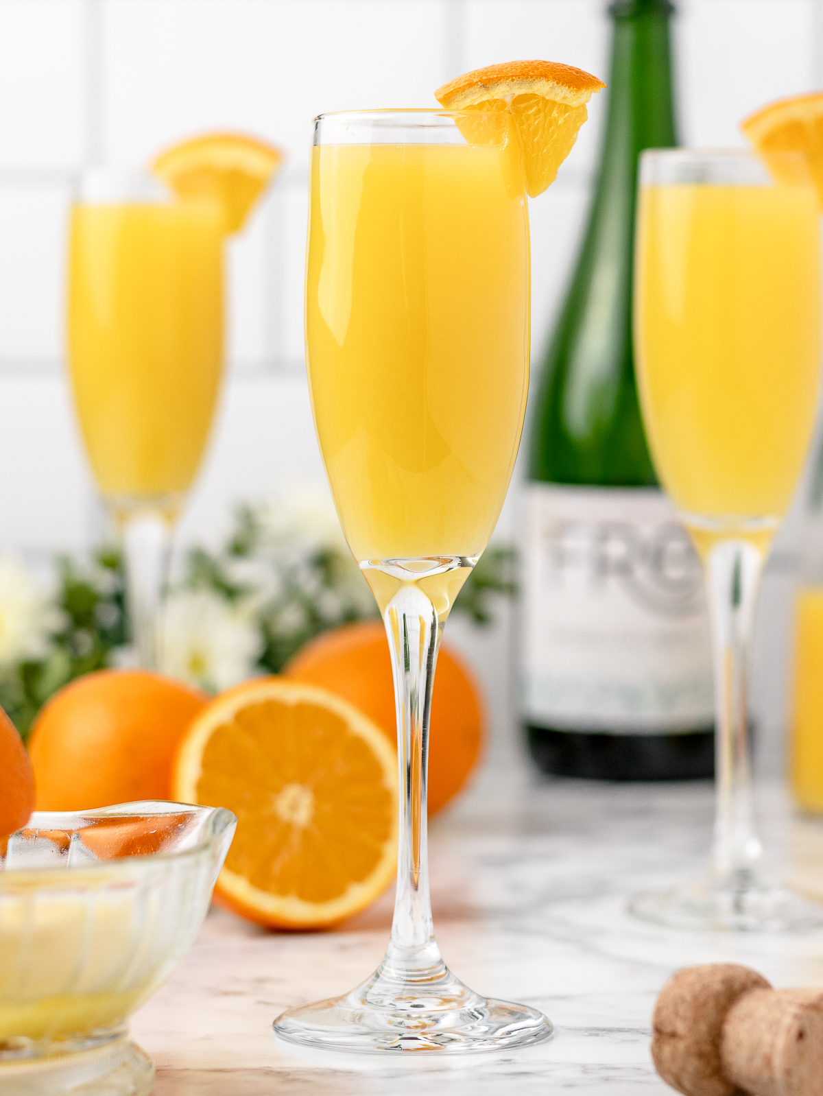 Mimosa Mocktails garnished with orange slice and ready to drink at brunch.