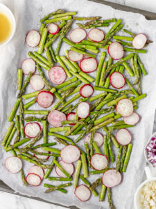 Directions 1. Asparagus and radishes coated in olive oil and seasoned with salt and pepper. Ready to go in the oven and roast.