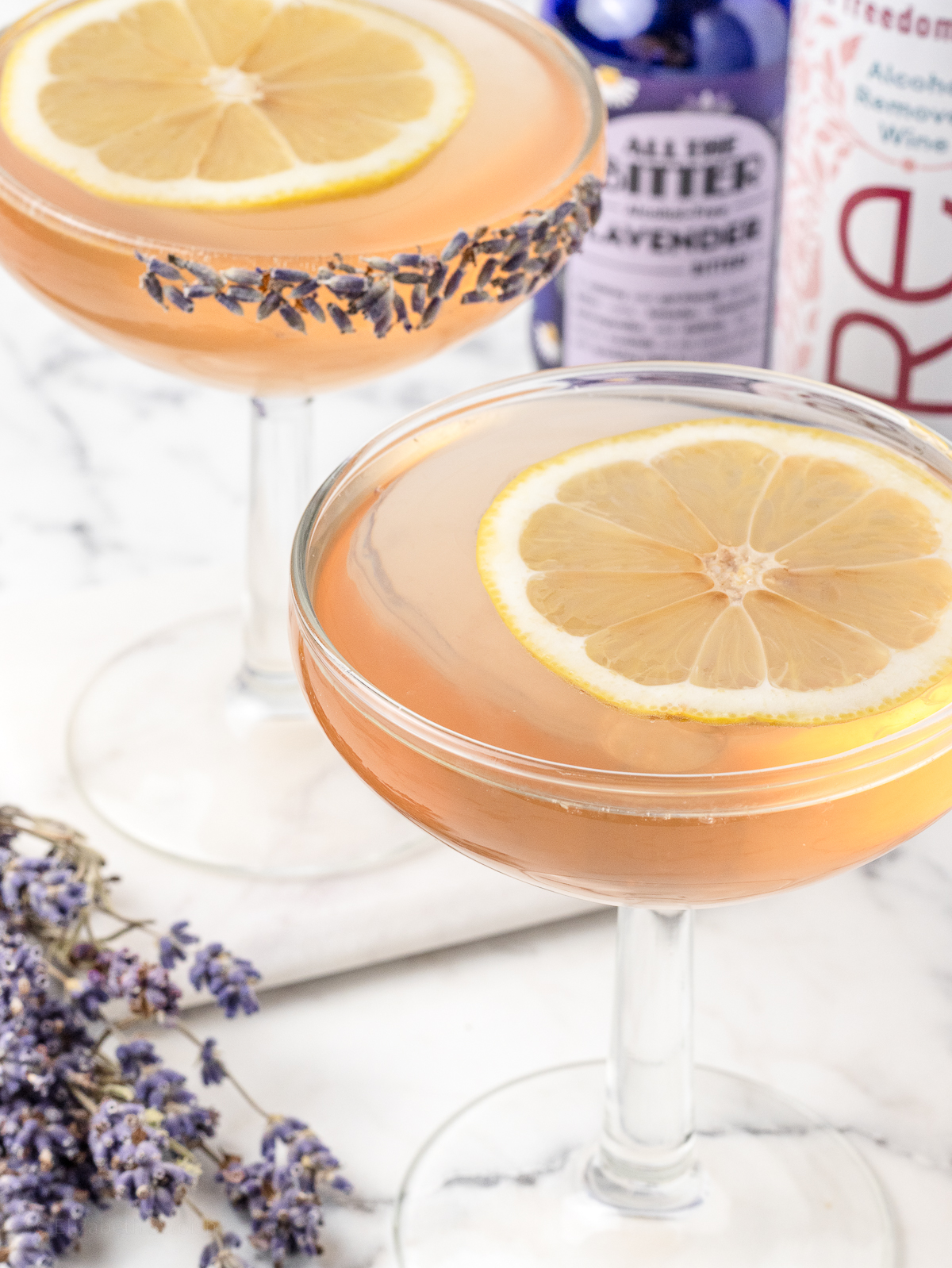 Close up of Sparkling Lavender Mocktail with a lemon slice floating on top.