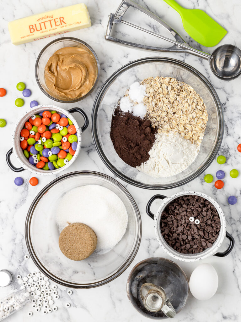 Ingredients. Unsalted butter, peanut butter, granulated sugar, brown sugar, egg, vanilla extract, old fashioned oats, all-purpose flour, black cocoa powder, baking powder, baking soda, salt, mini chocolate chips, Halloween M&M's, and candy eyes.