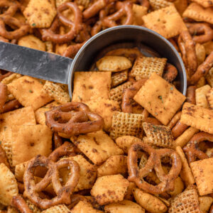 Taco Snack Mix with a scoop for scooping and eating.