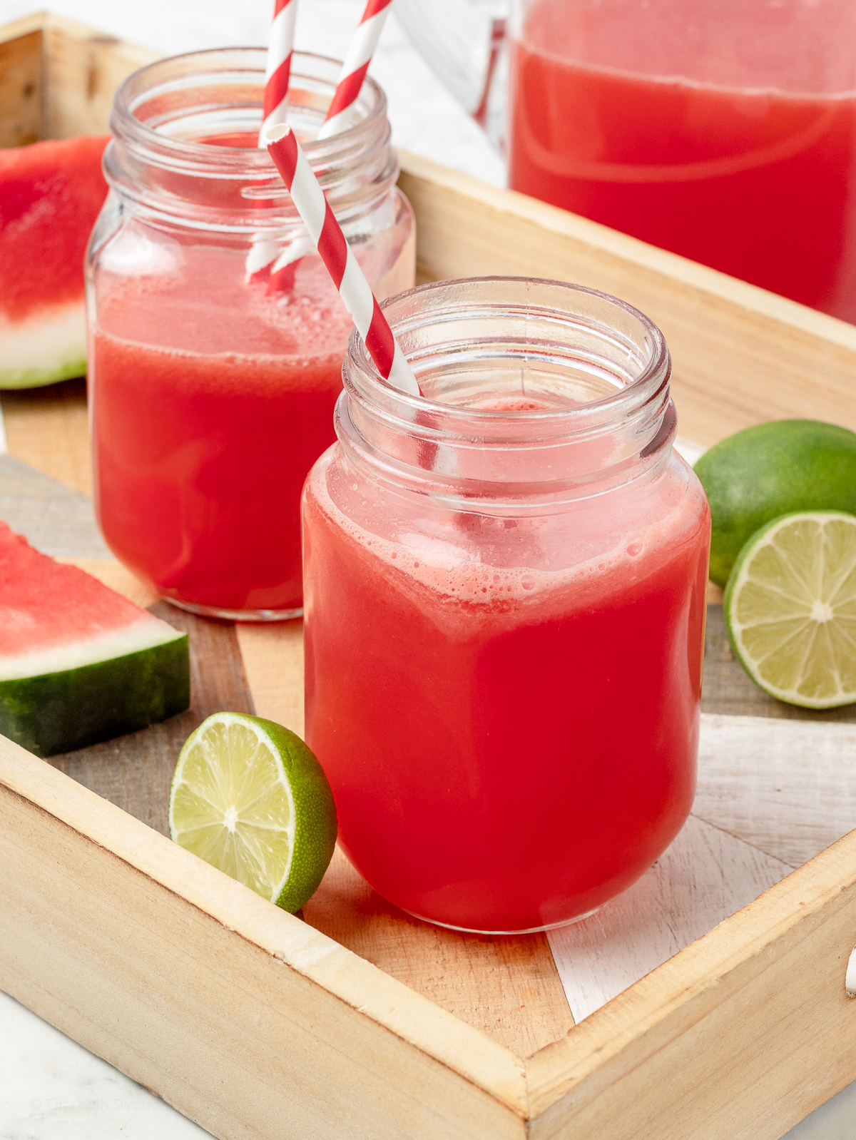 Two jars of limeade ready for sipping.