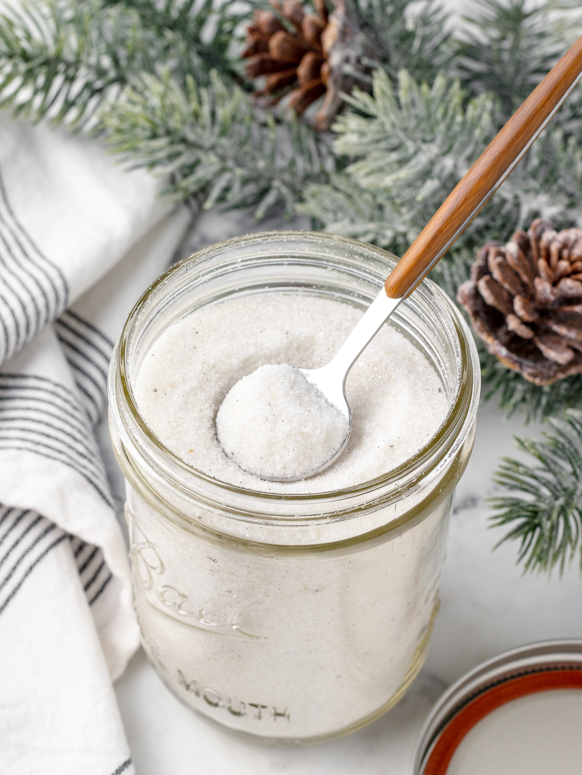 Spoon in the sugar. You can see the black vanilla bean flecks.