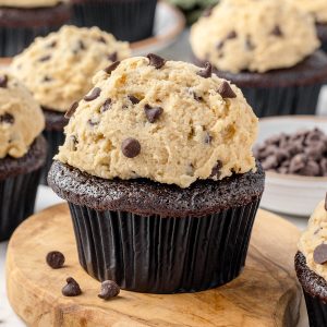 Chocolate Chip Cookie Dough Cupcakes with mini semi-sweet chocolate chips on the side.