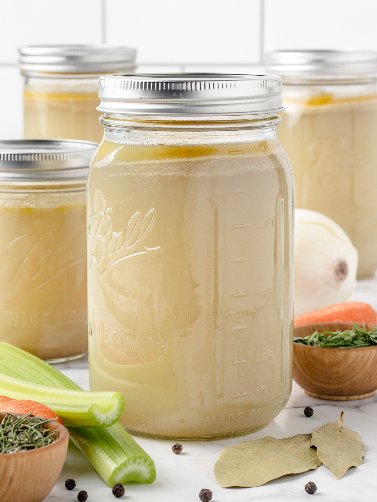 4 jars of stock ready to refrigerate and freeze.