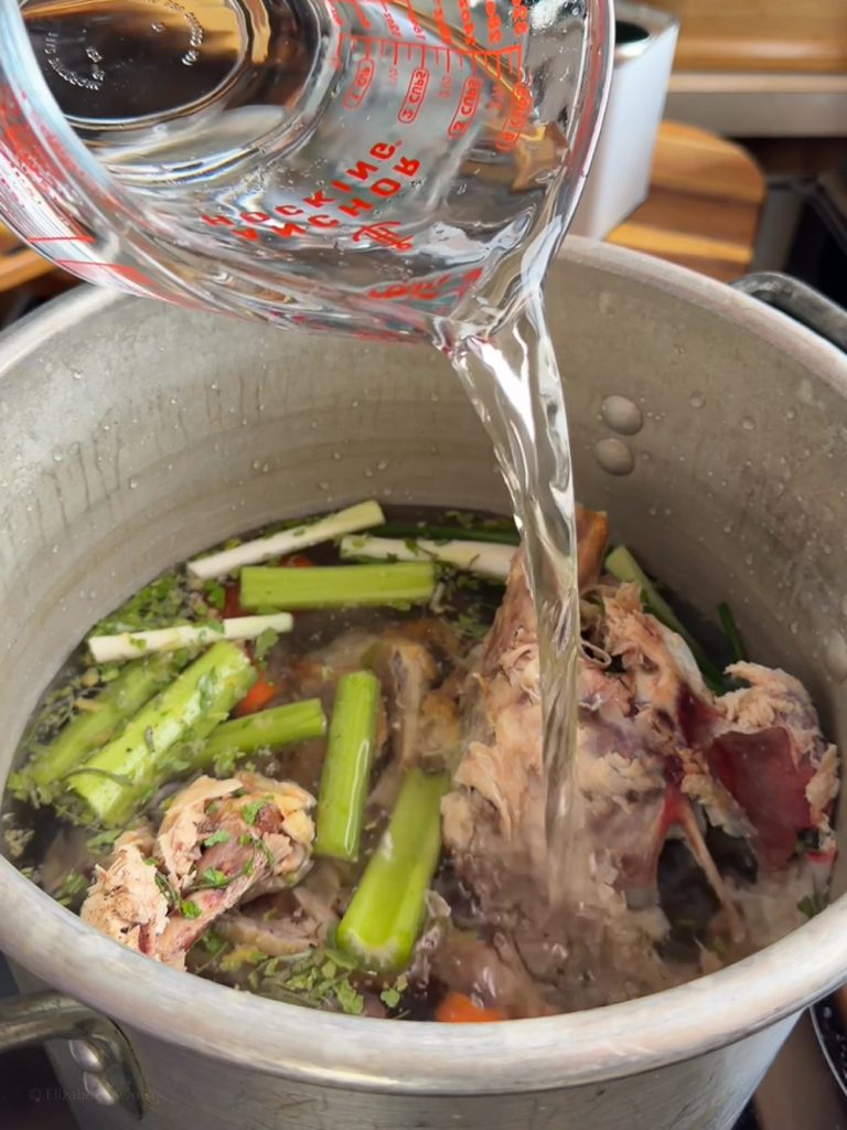 Ingredients in a large stock pot, ready to simmer and be made into stock.