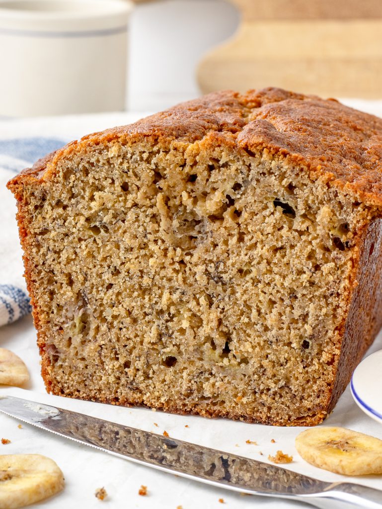 The Fresh Milled Banana Bread cut to see a tender, soft, but stable crumb. There are pockets of banana and spices.