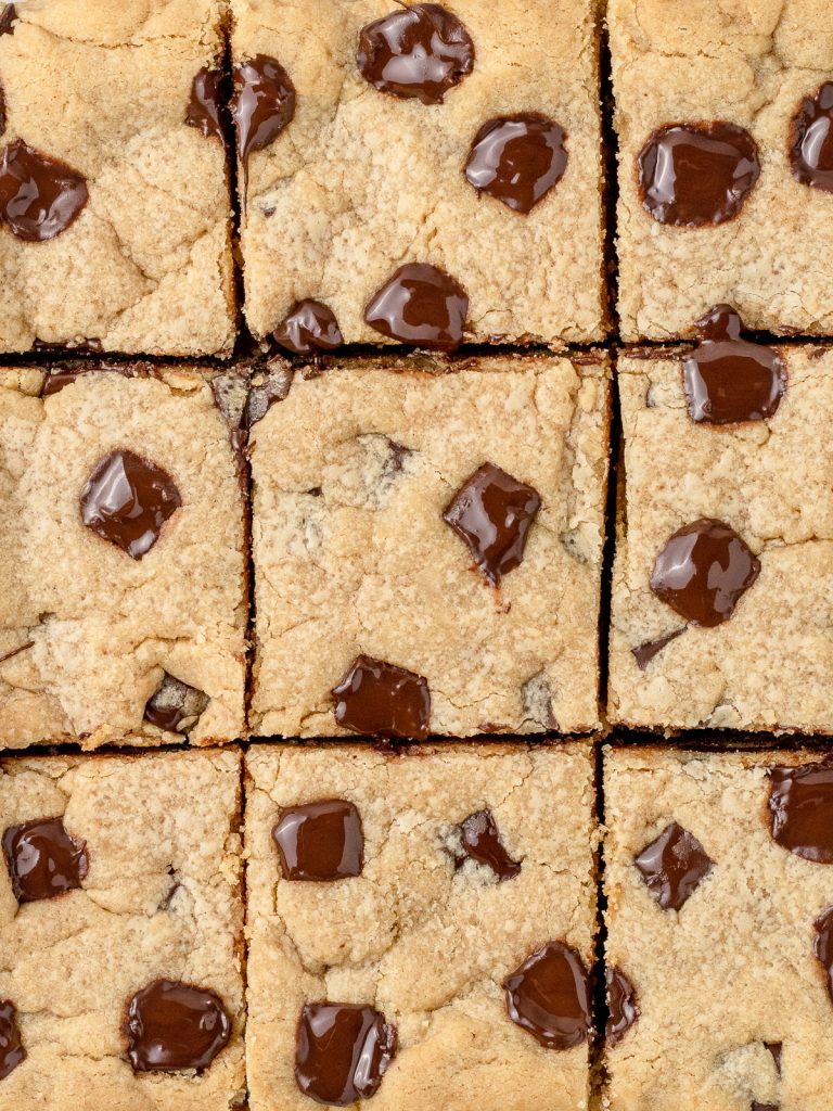 Overhead image of bars cut into 9 squares. You can see melty chocolate chunks.