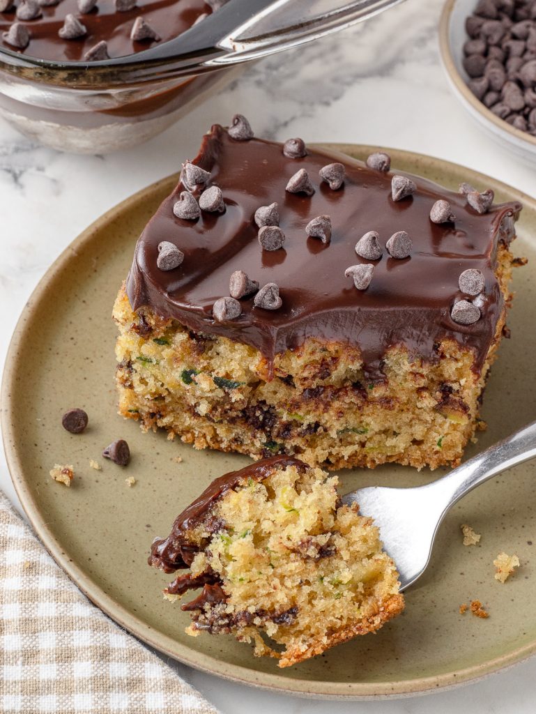 Plate of cake with a fork of cake on it.